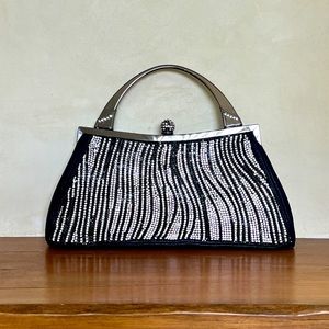 Leather zebra encrusted handbag with silver metal handle